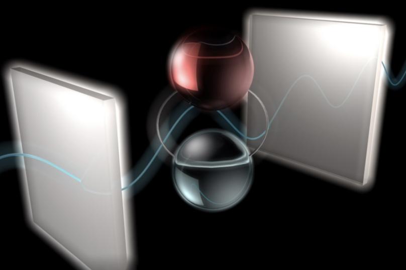 two silver devices with particles in the middle