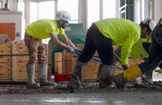 Men pouring cement