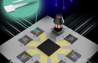 computer chip with yellow wires and tweezers