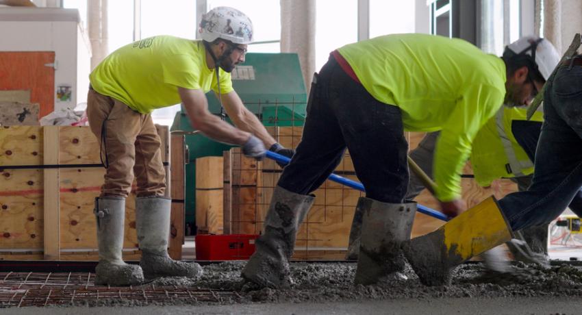 Men pouring cement